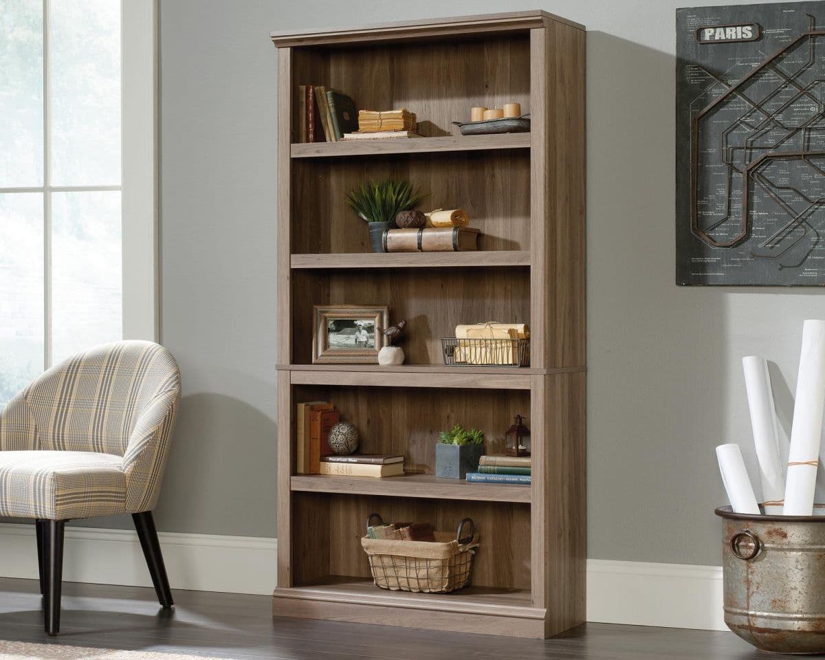 Tall bookcase with various items on each shelf