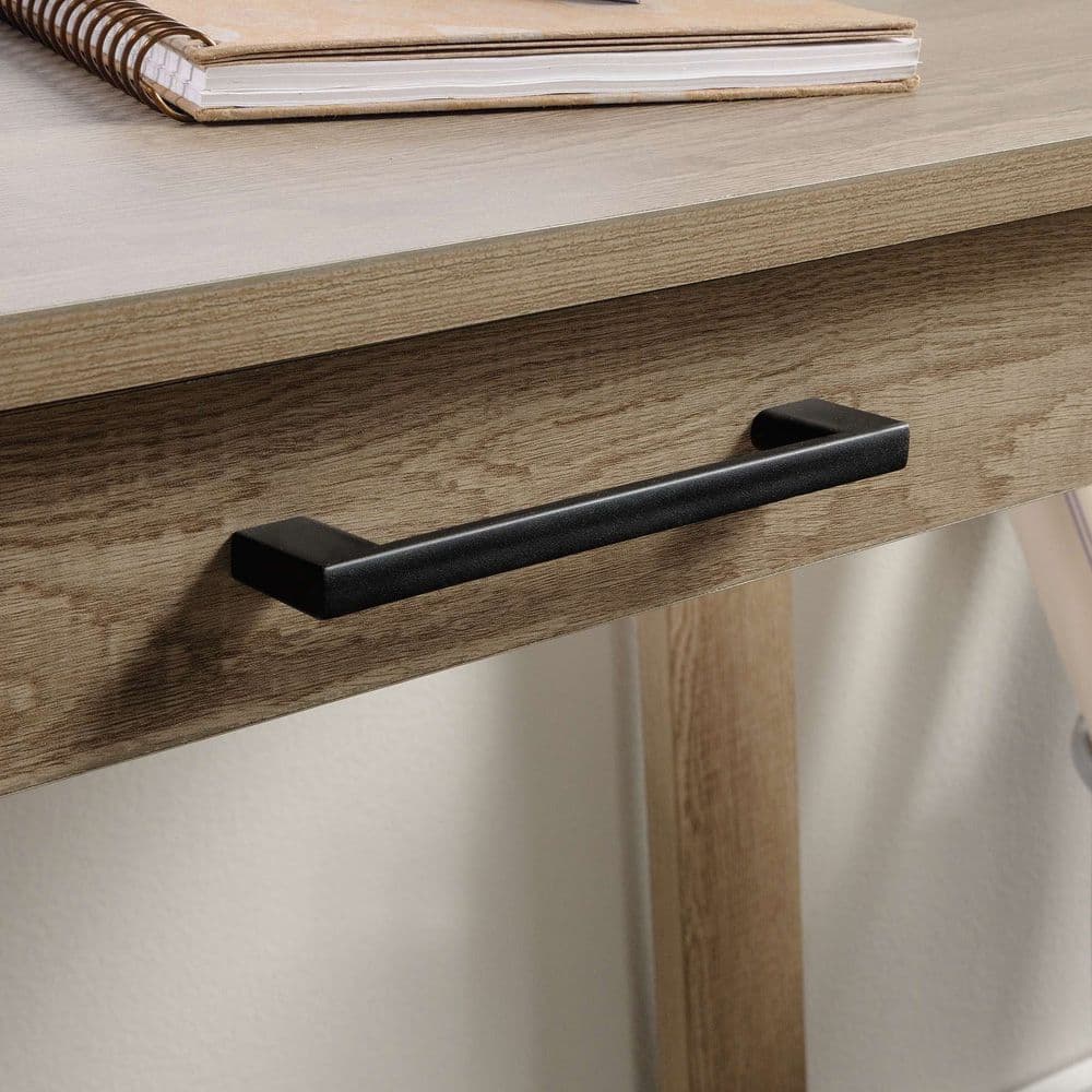 a close up of a wooden table with a book on it