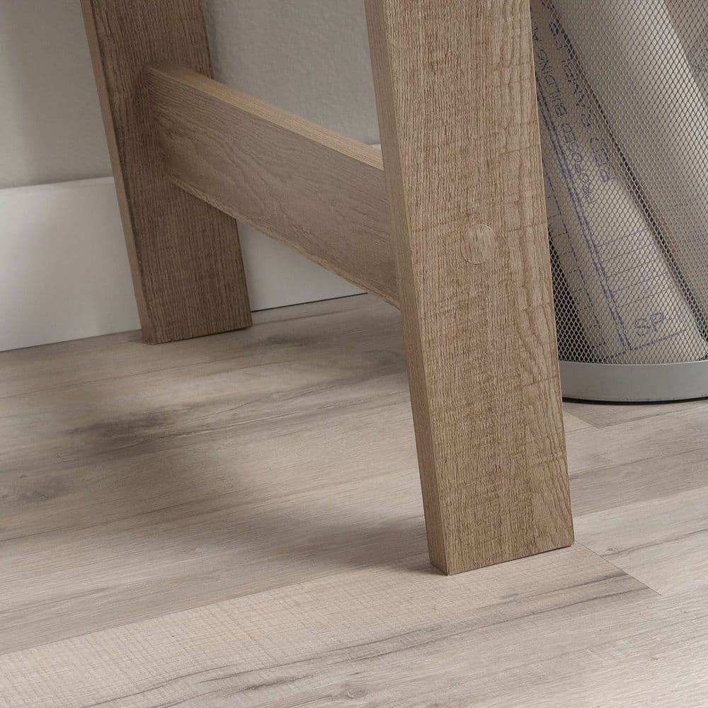 a close up of a wooden floor with a mesh curtain