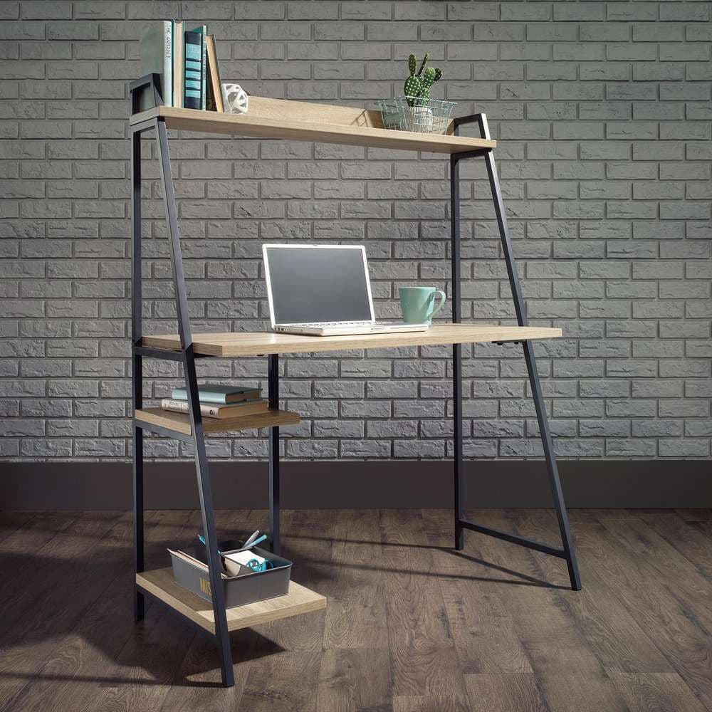 a computer desk with a laptop on top of it