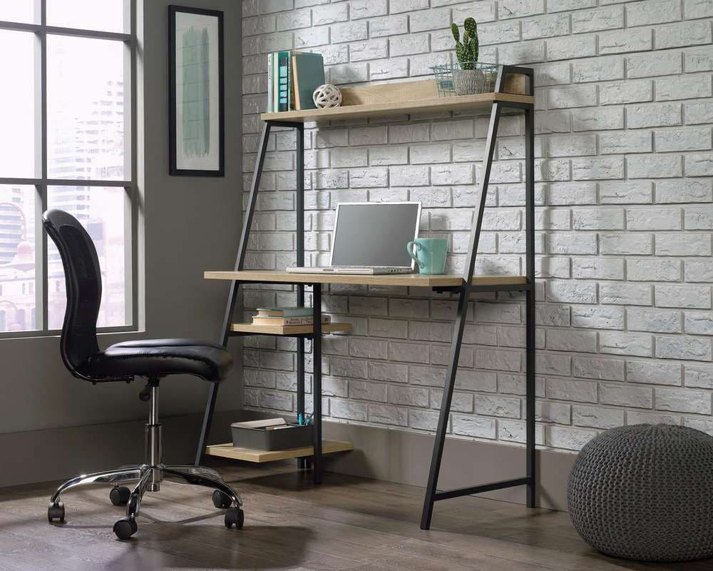 a computer desk with a laptop on top of it