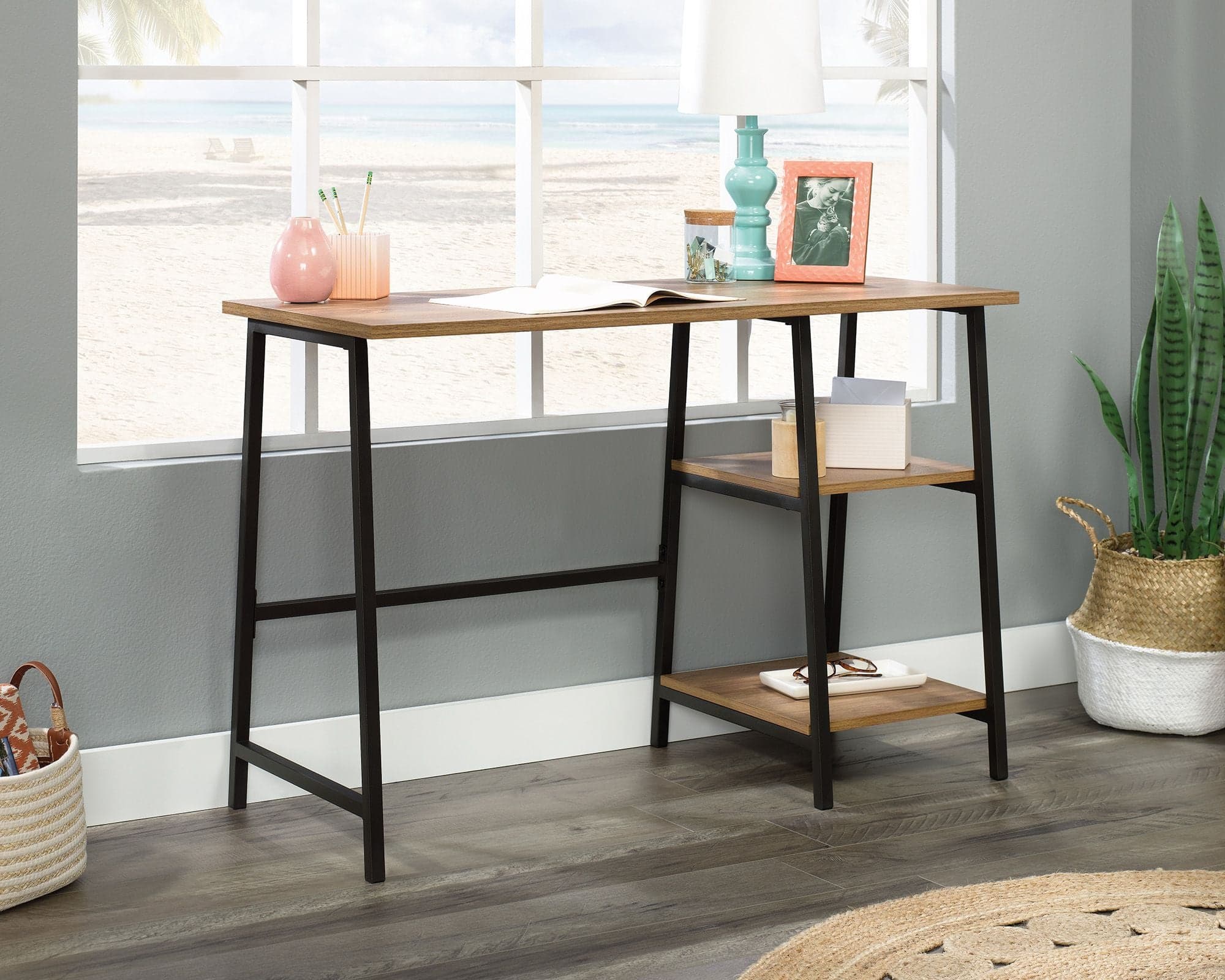 a wooden desk with a plant on top of it