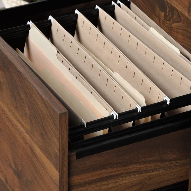 a close up of a drawer with files in it