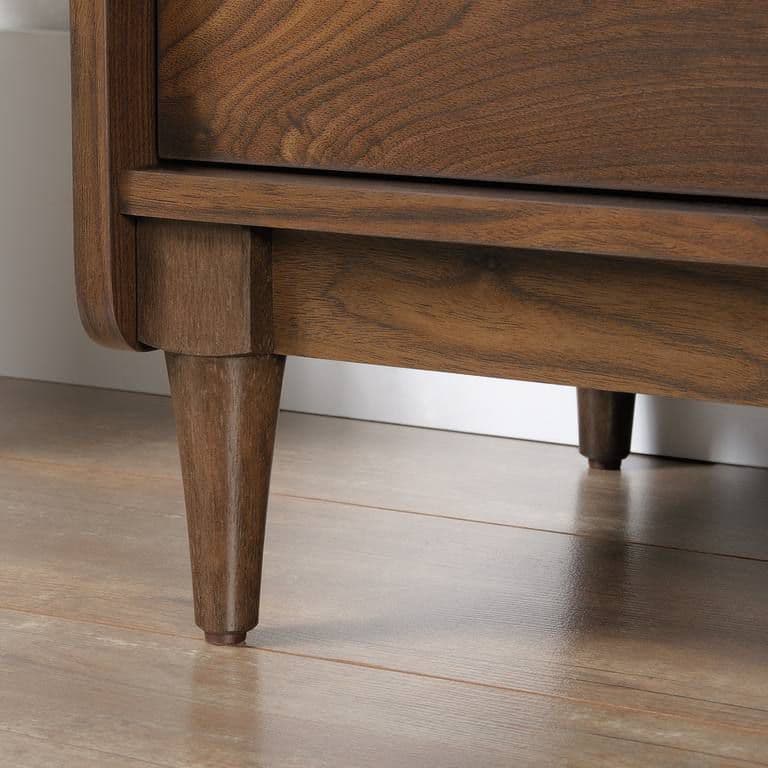 a close up of a wooden table with a drawer