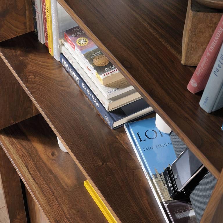 a book shelf with books on top of it