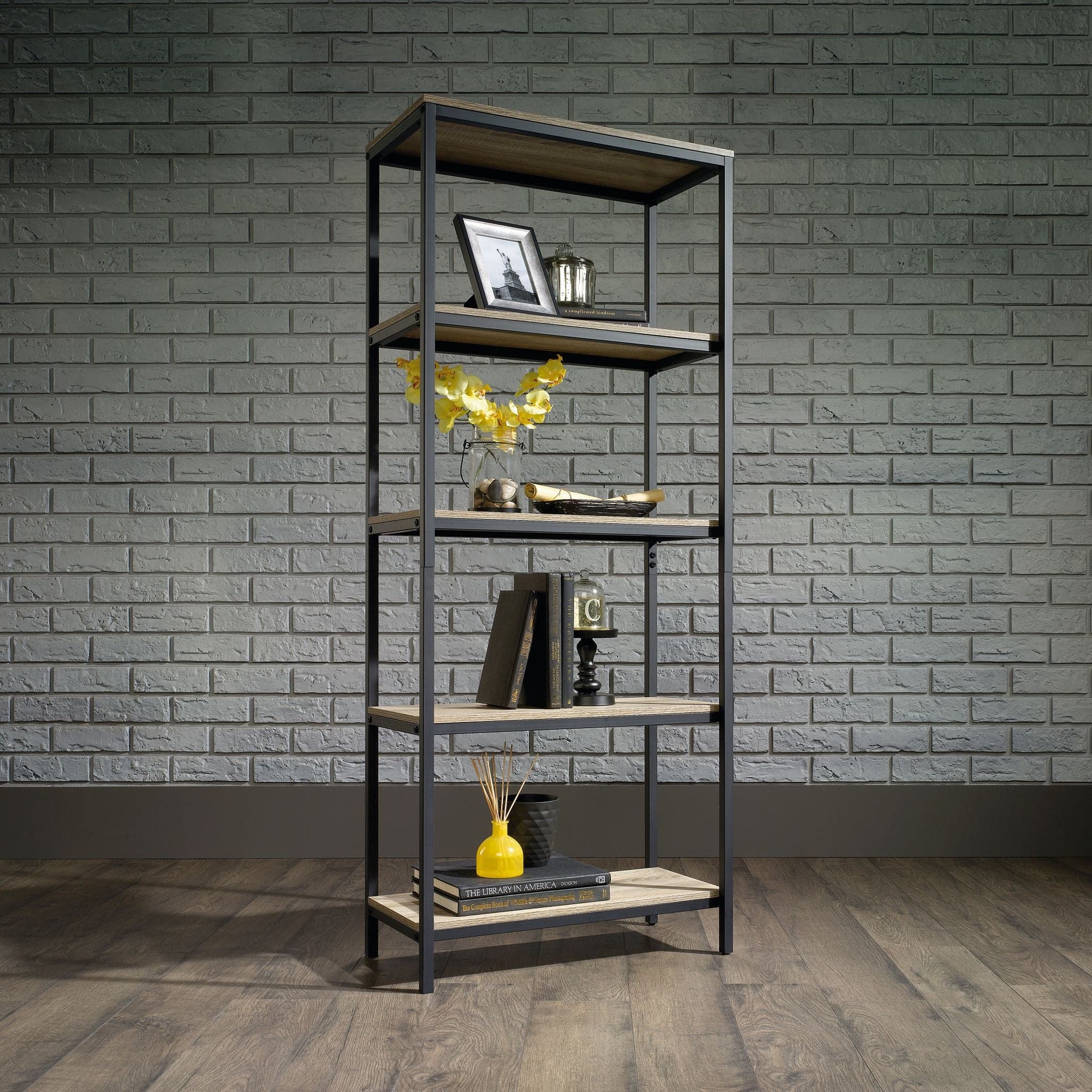 a shelf with books and a vase on top of it