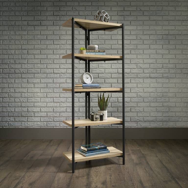 a book shelf with a brick wall in the background