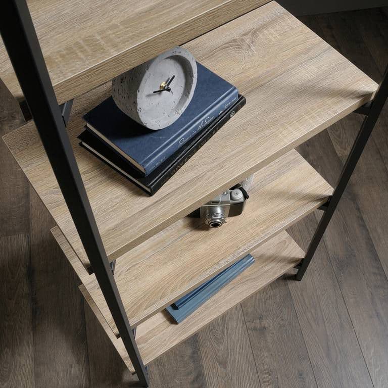 a clock sitting on top of a wooden table