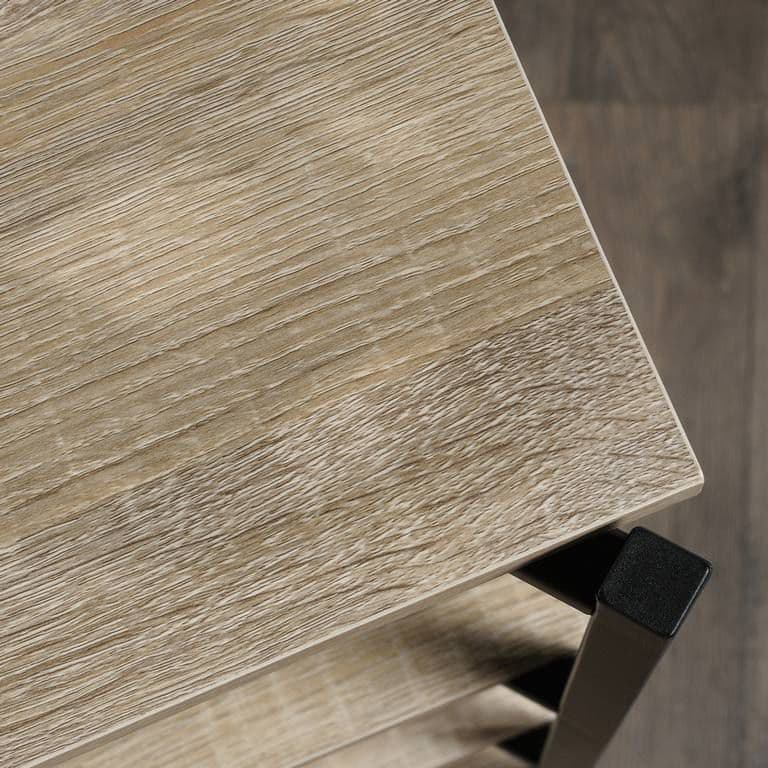 a close up of a wooden table with a black handle