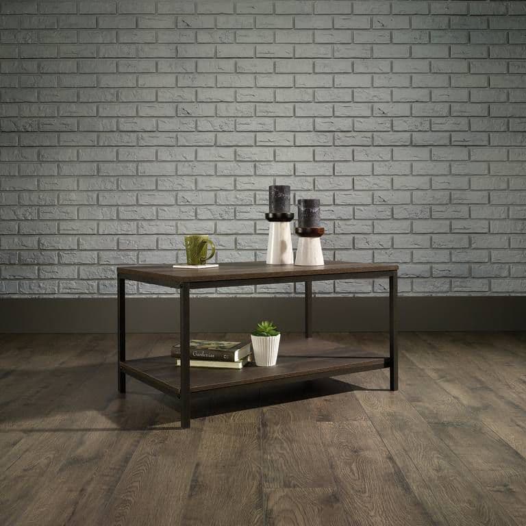 a coffee table with two vases on top of it