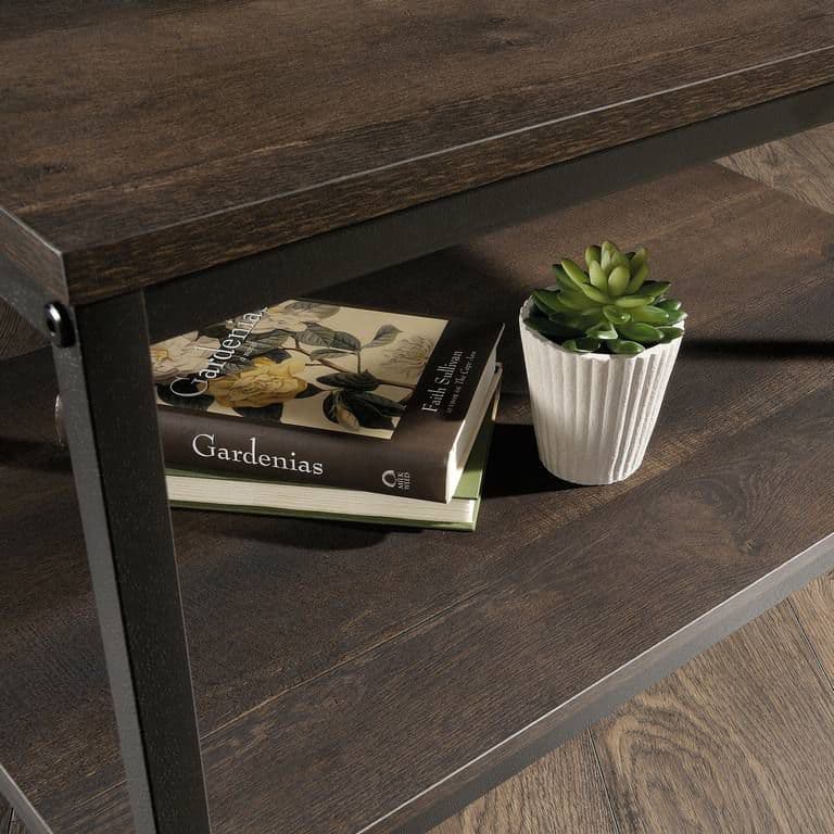 a table with a book and a plant on it