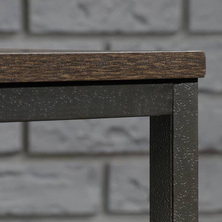 a close up of a wooden table near a brick wall