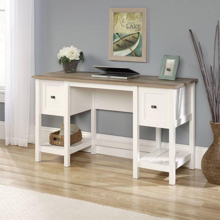 a white desk with drawers and a vase with flowers