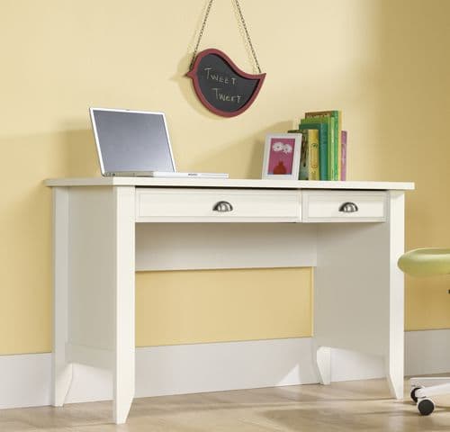 a white desk with a laptop on top of it