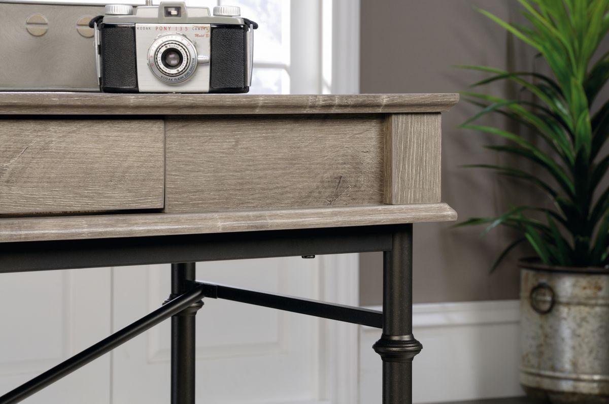 a camera sitting on top of a table next to a potted plant