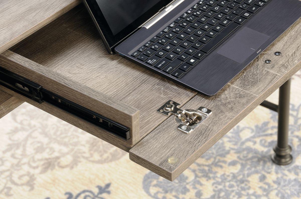 a laptop computer sitting on top of a wooden desk