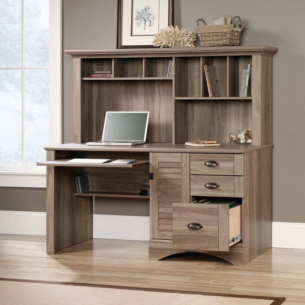 a wooden desk with a laptop on top of it