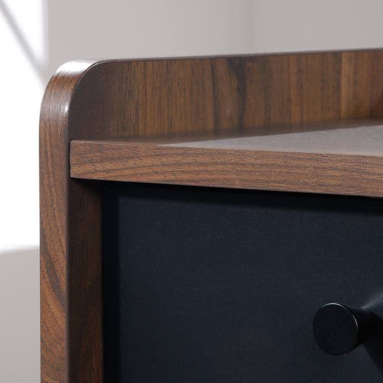 a close up of a wooden cabinet with a black drawer