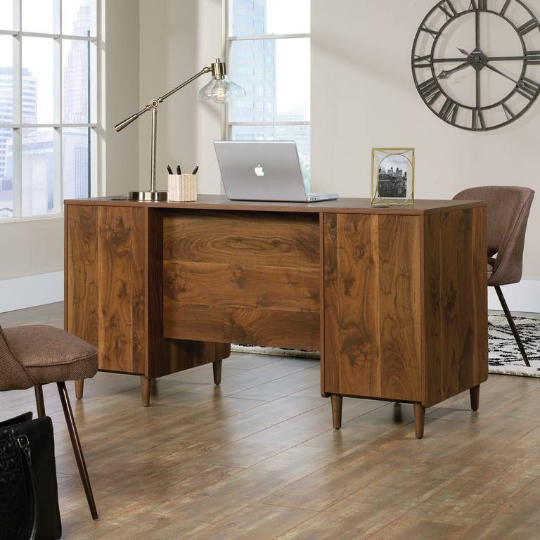 a wooden desk with a laptop on top of it