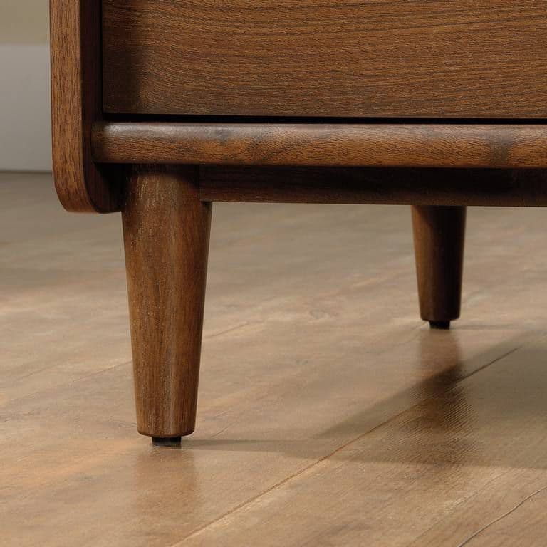 a close up of a wooden table on a hard wood floor