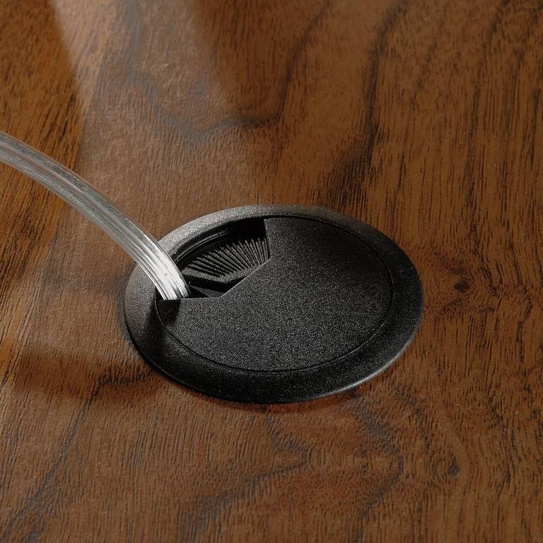 a close up of a spoon on a wooden table