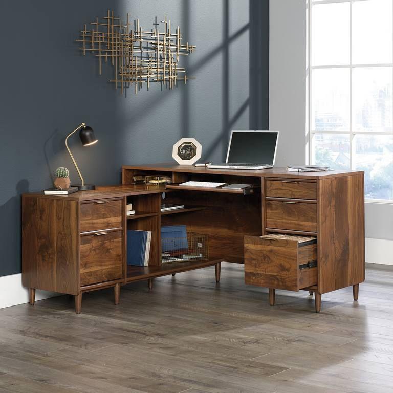 a wooden desk with a laptop on top of it