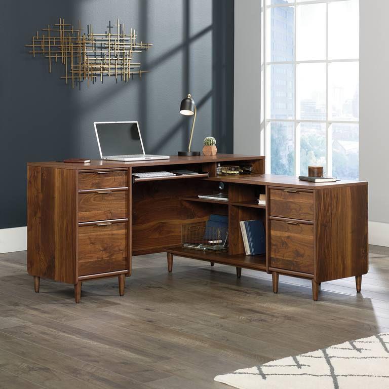 a wooden desk with a laptop on top of it