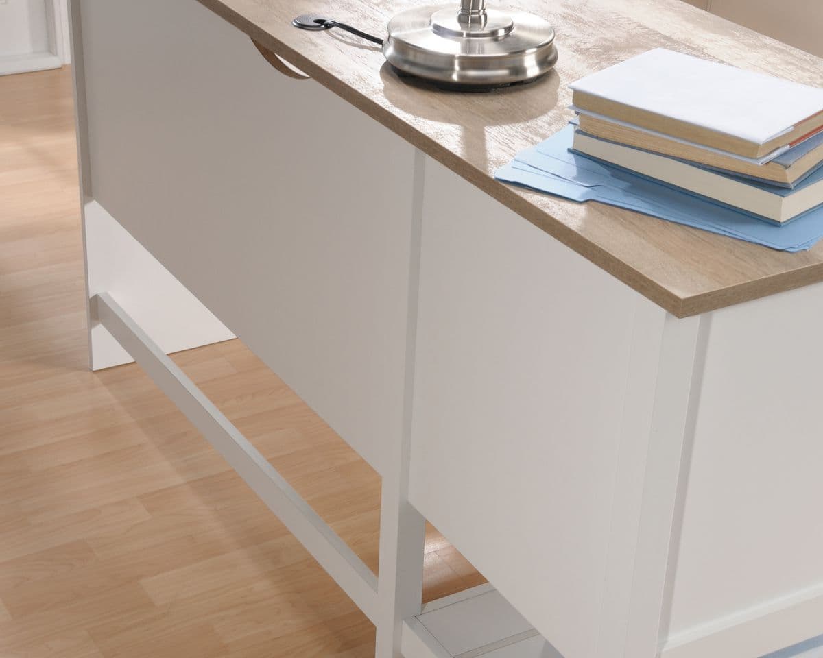 a kitchen counter with a stack of books on top of it