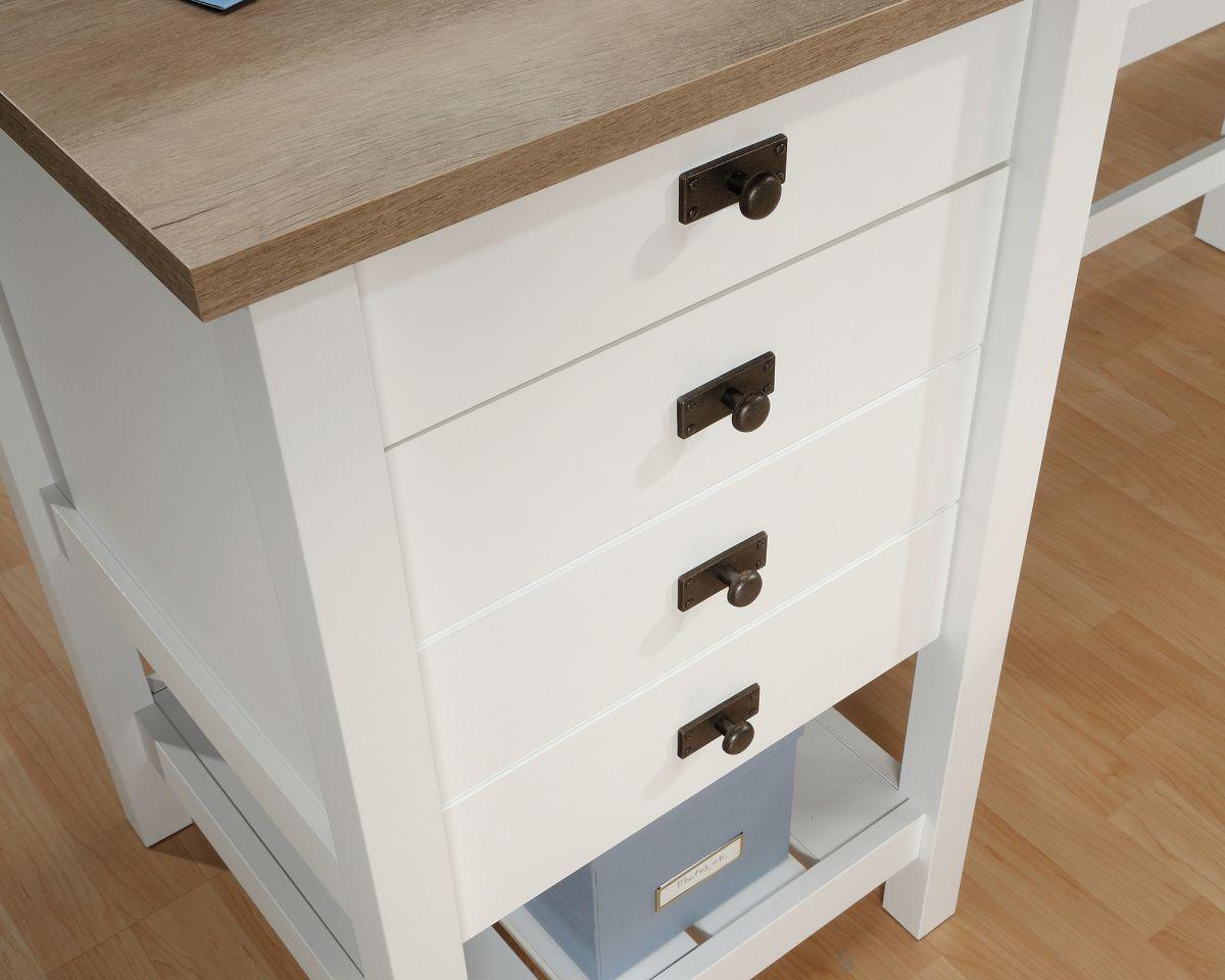 a white dresser with a wooden top and drawers