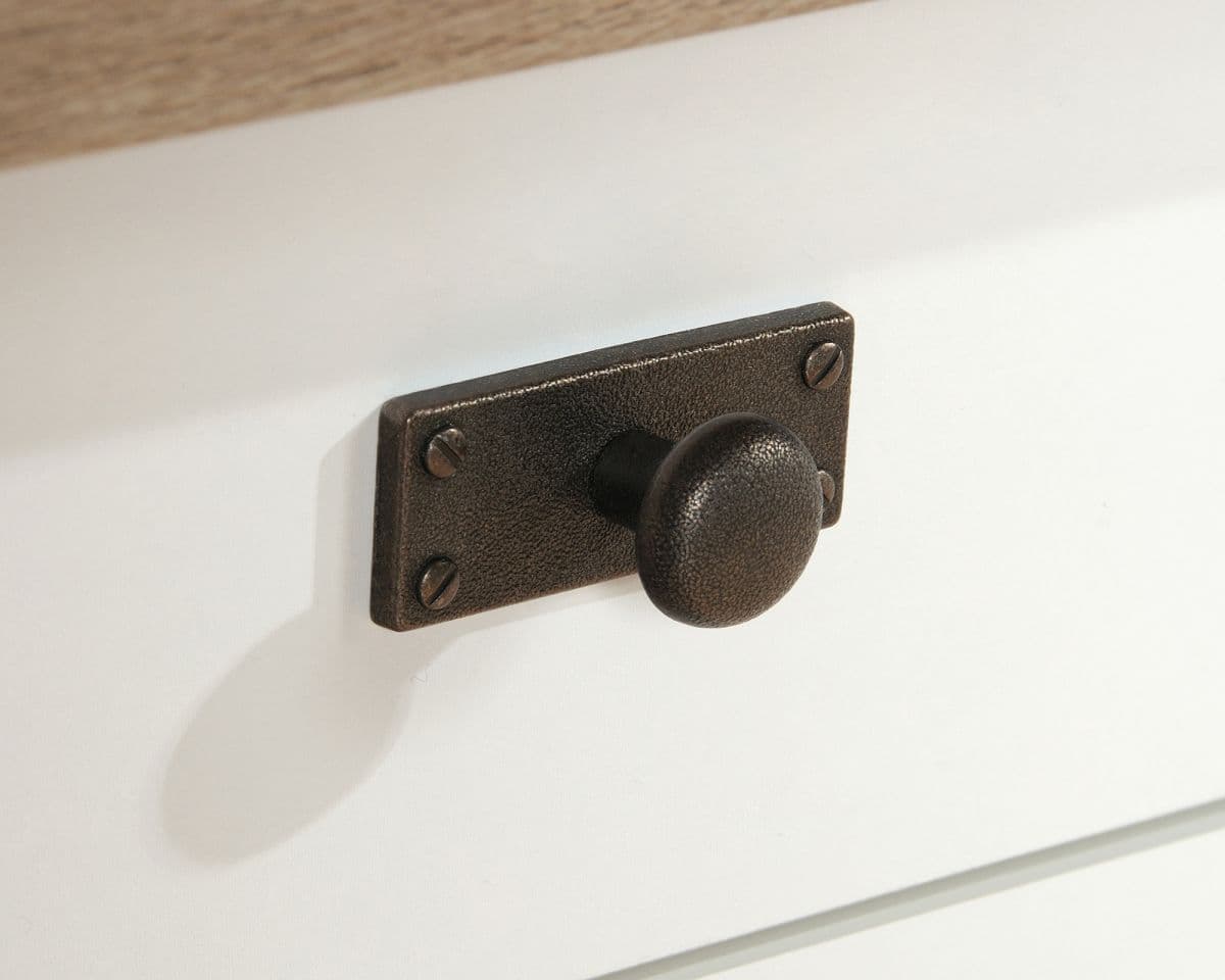 a close up of a door handle on a cabinet