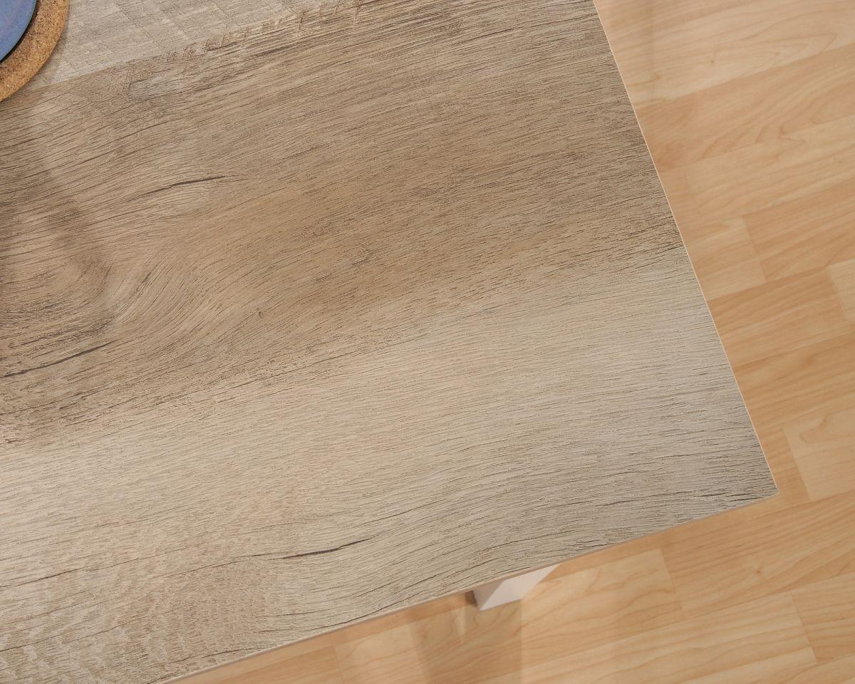 a close up of a wooden table with a clock on it