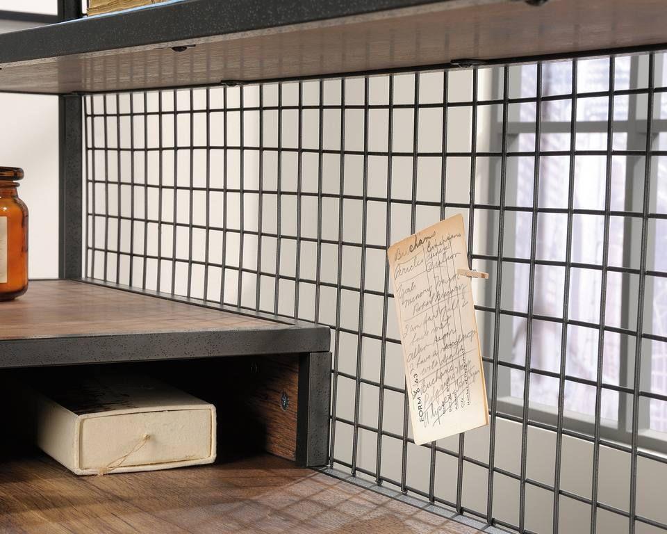 a wooden table topped with a jar and a piece of paper