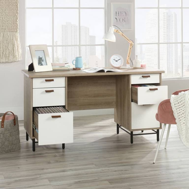 a desk with a chair and a clock on it