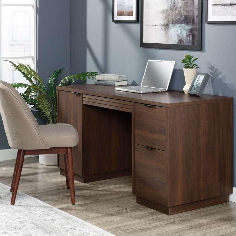 a wooden desk with a laptop on top of it