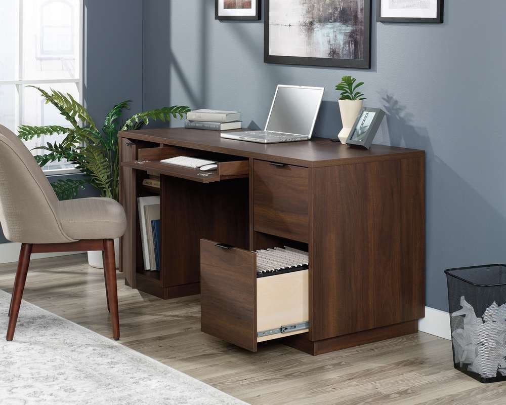 a computer desk with a laptop on top of it