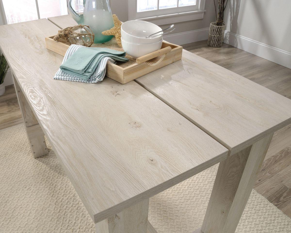 a wooden table with a bowl of food on top of it