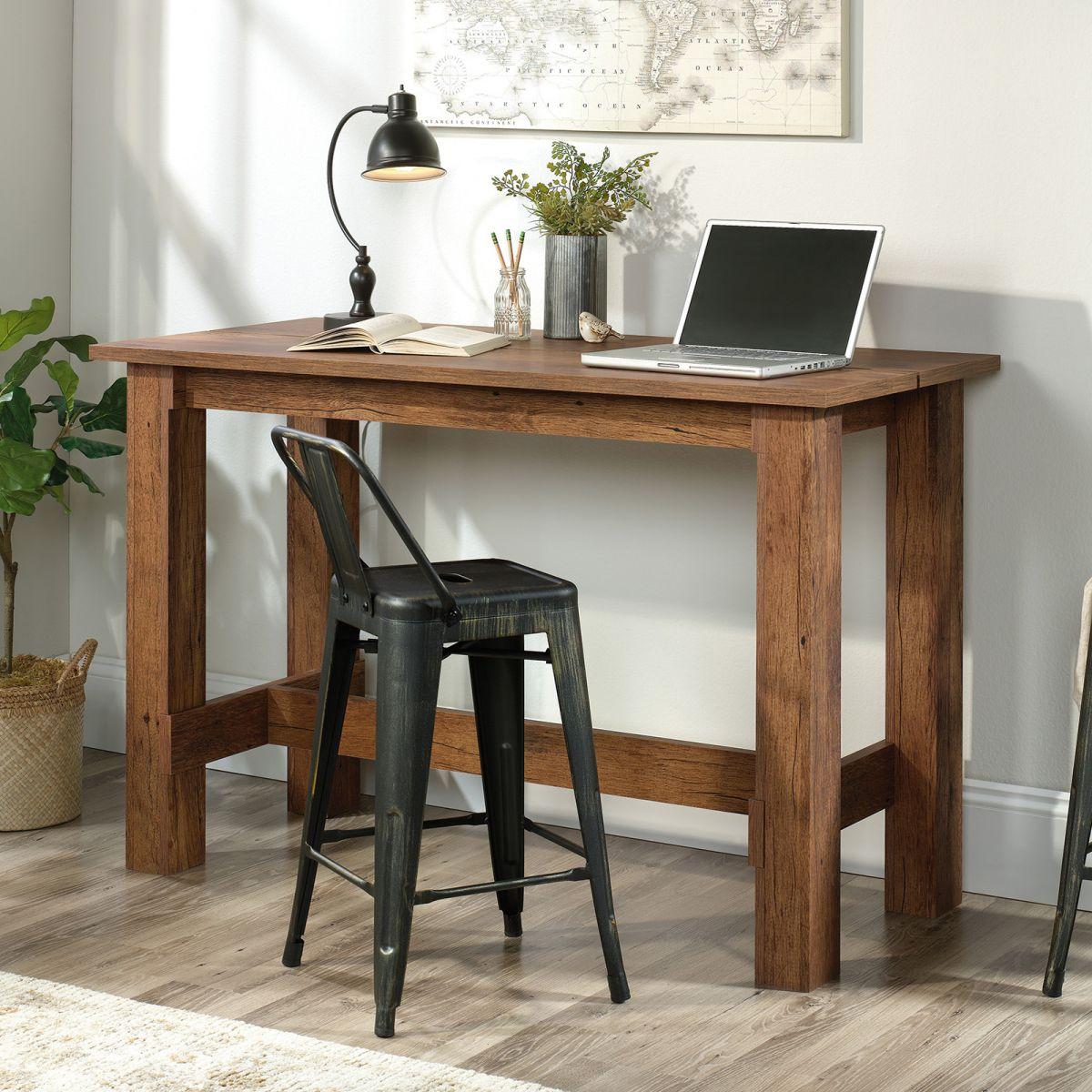 a wooden desk with a laptop on top of it