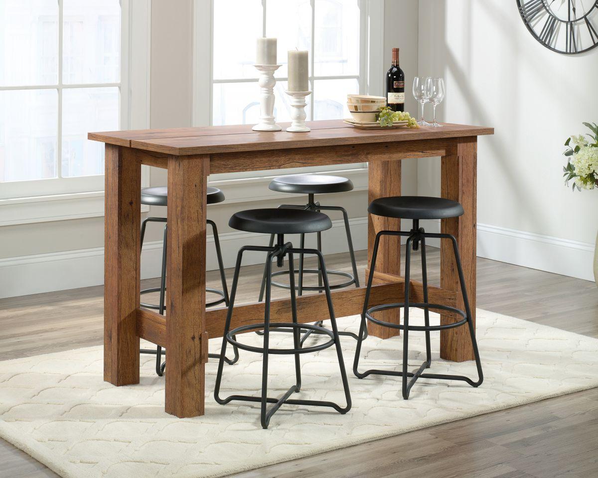 a kitchen table with three stools in front of it