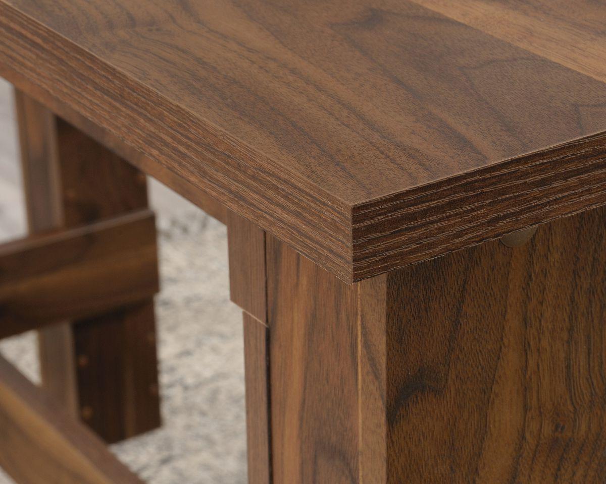 a close up of a wooden table with a metal base