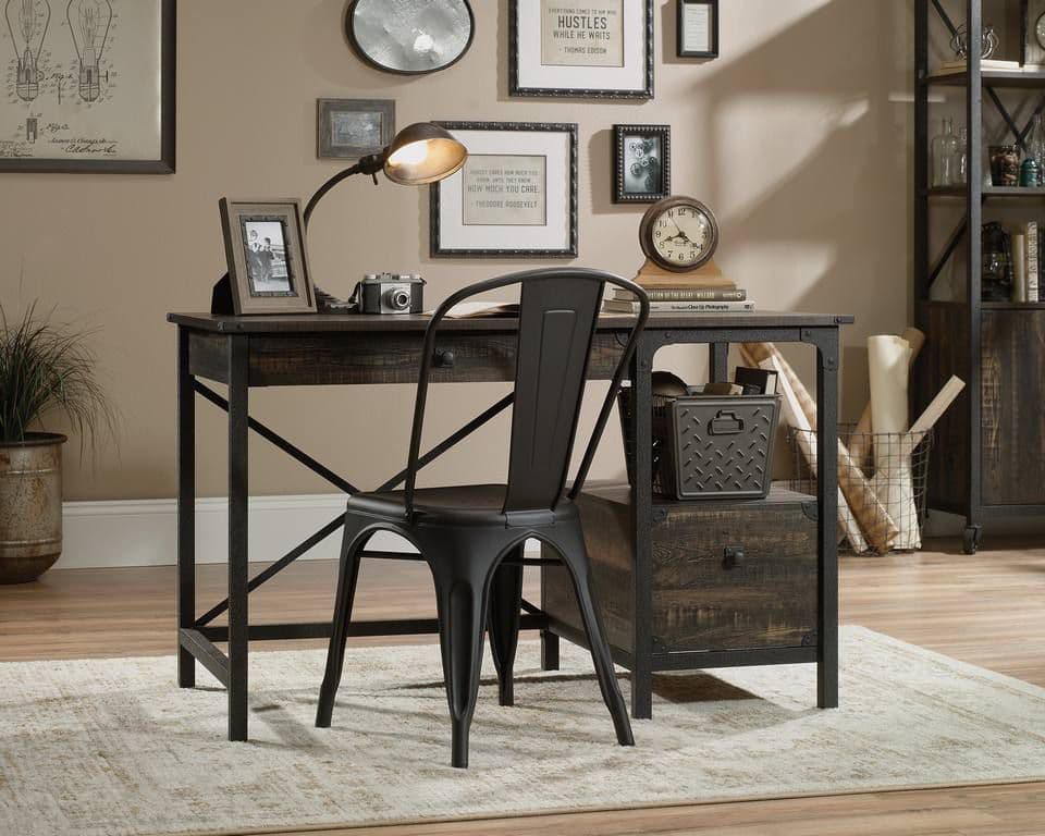 a desk with a chair and a clock on it