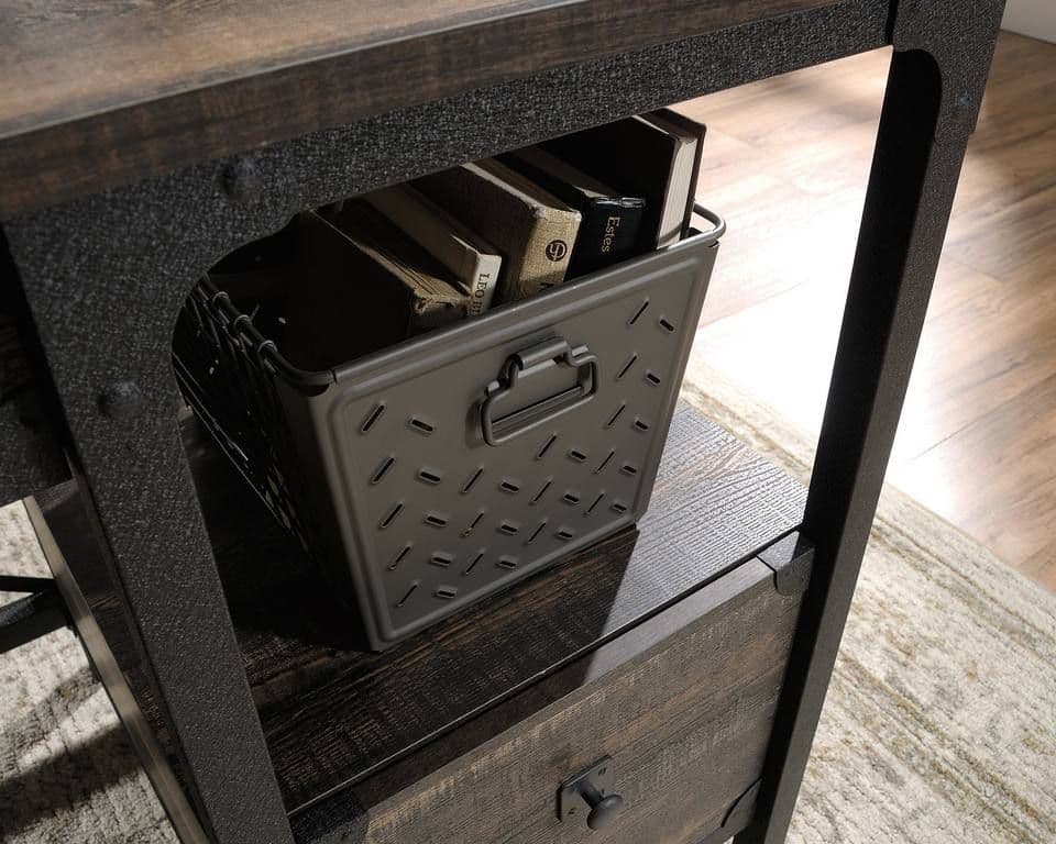 a metal box sitting on top of a wooden table