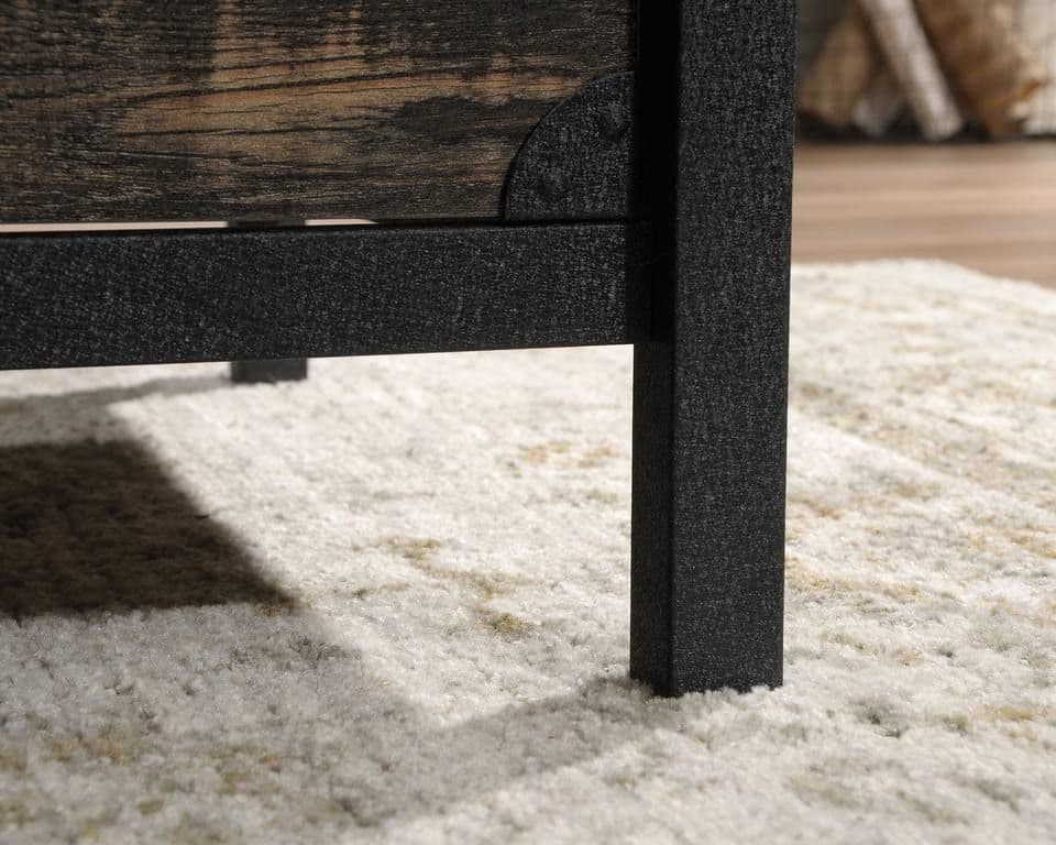 a close up of a wooden table with a white rug