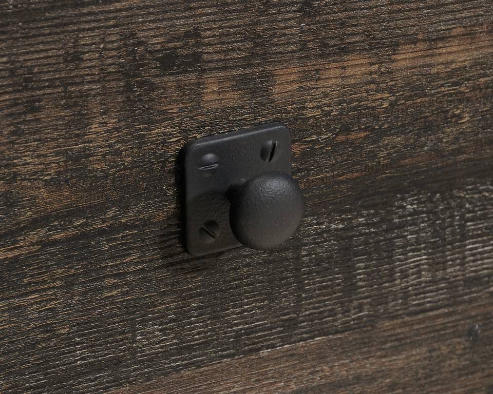 a close up of a door handle on a wooden door