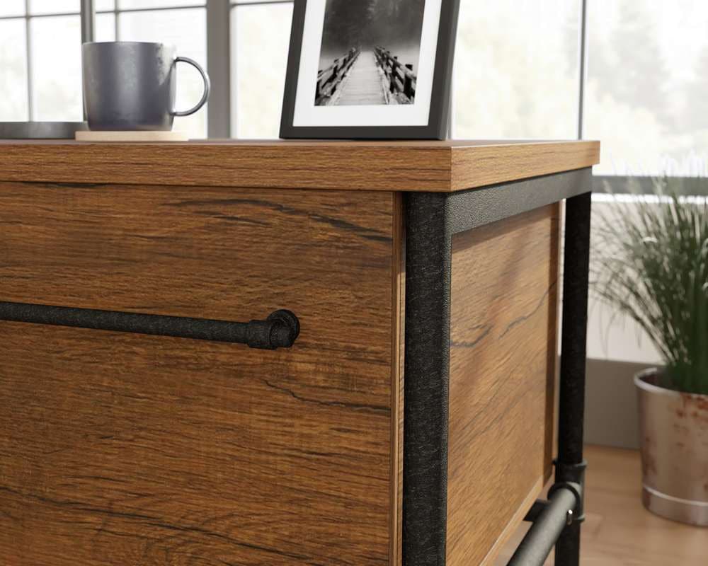 a wooden dresser with a picture on top of it