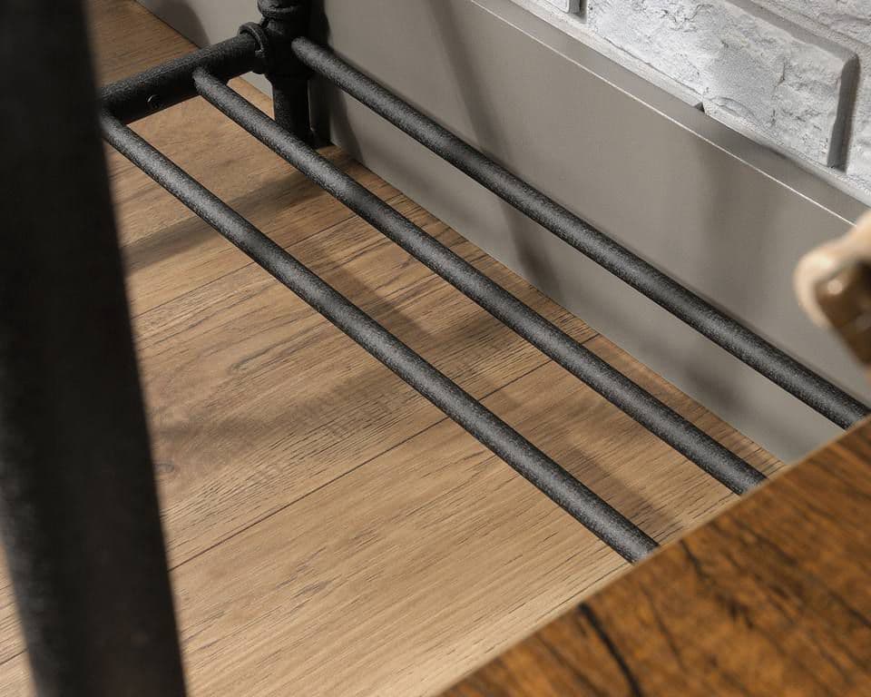 a close up of a metal rail on a wooden floor