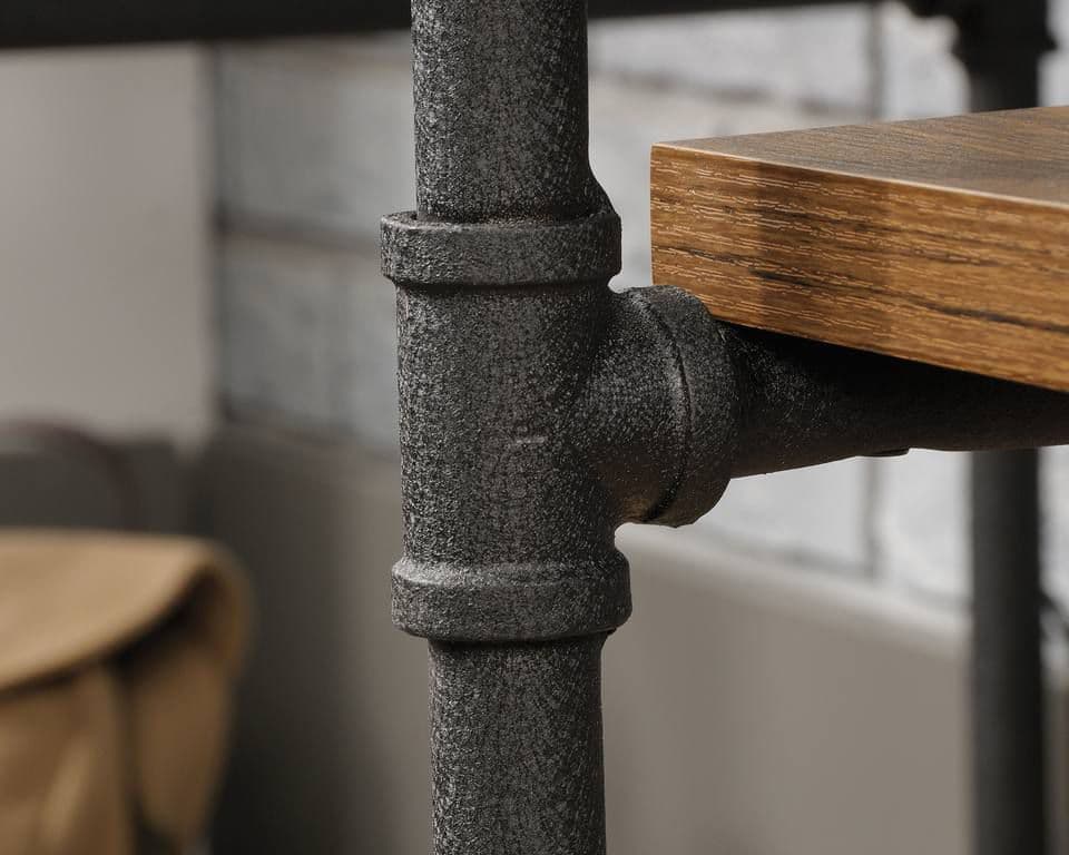 a close up of a wooden table with metal pipes