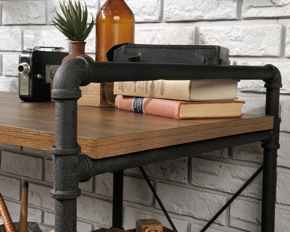 a shelf with books and a camera on it