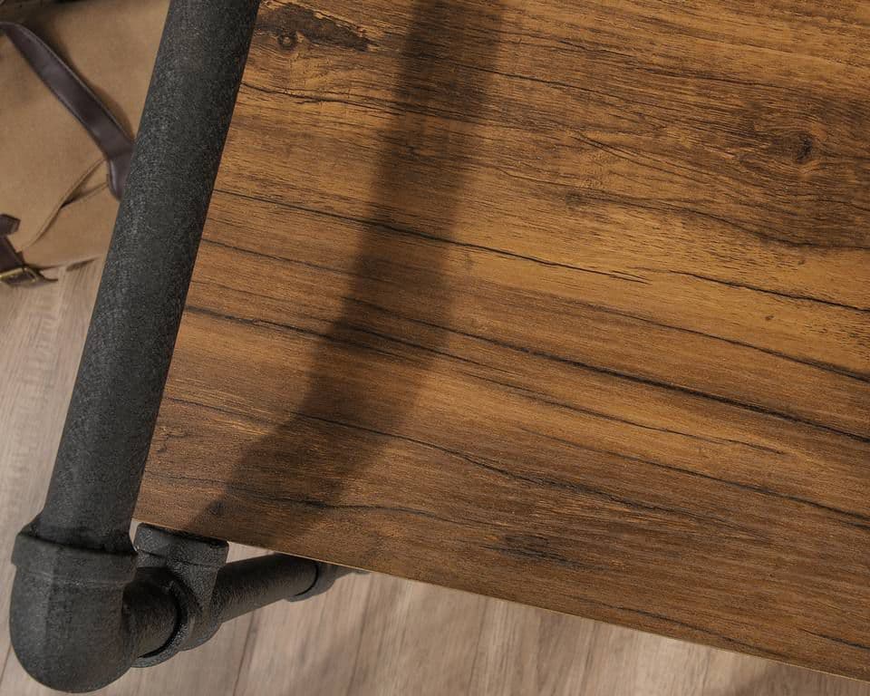 a close up of a wooden table with metal legs