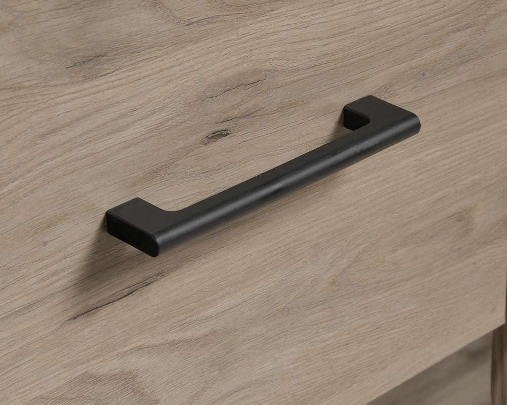 a black handle on a wooden drawer