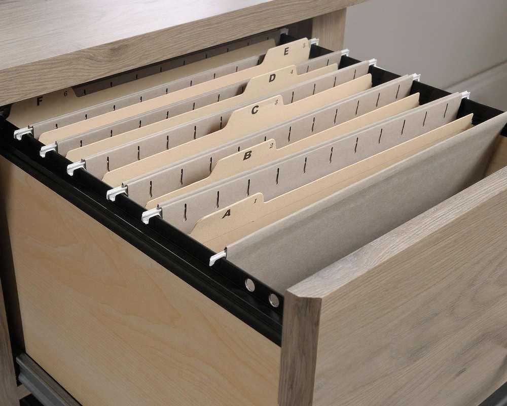 a drawer with a bunch of files in it